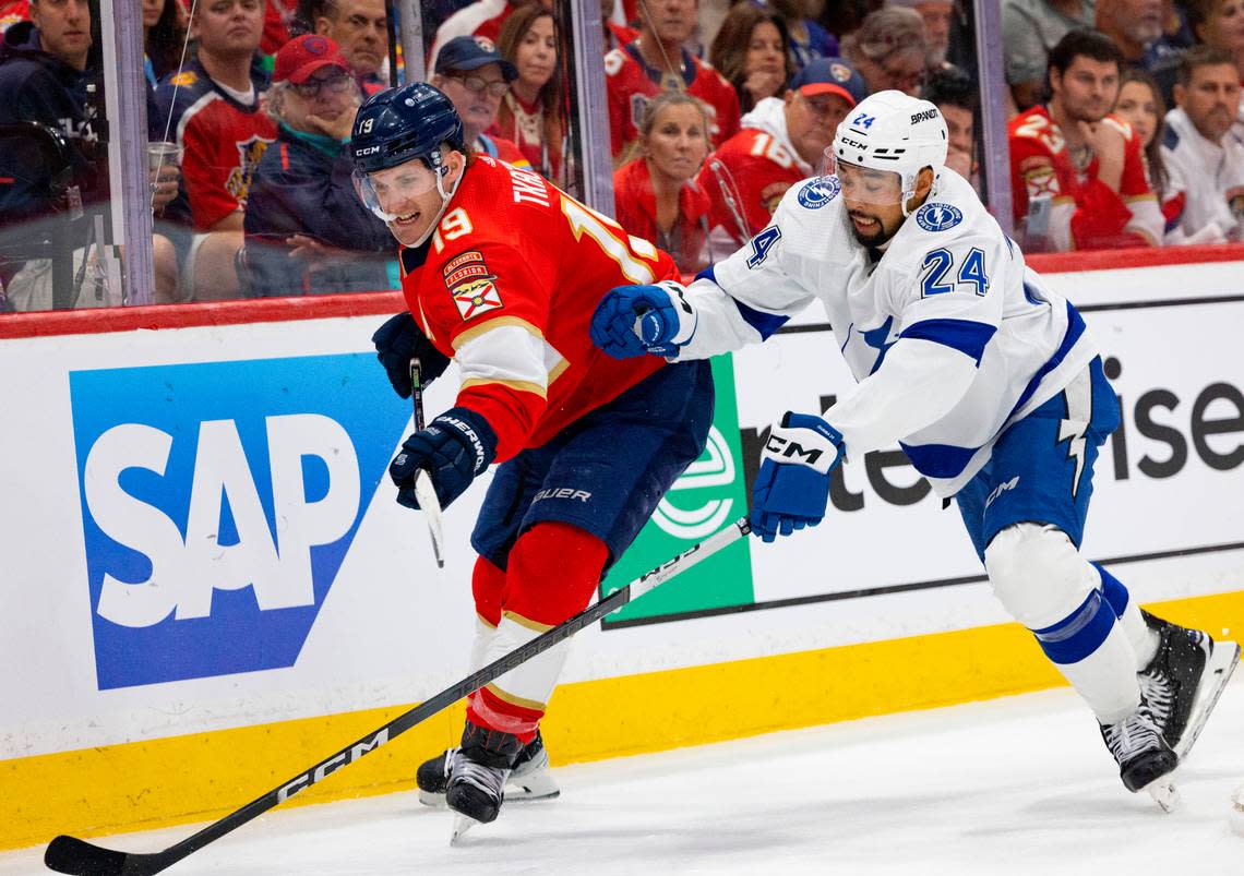 Florida Panthers left wing Matthew Tkachuk (19) and Tampa Bay Lightning defenseman Mathew Dumba (24) go for the puck during the second period of Game 1 of the Stanley Cup Playoffs Round 1 on Sunday, April 21, 2024, at Amerant Bank Arena in Sunrise, Fla. The score was 1-1 at the end of the second period.