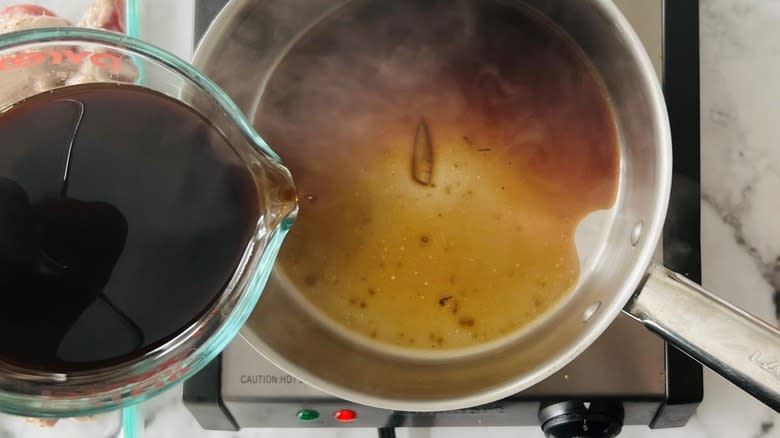 pouring vinegar in pan