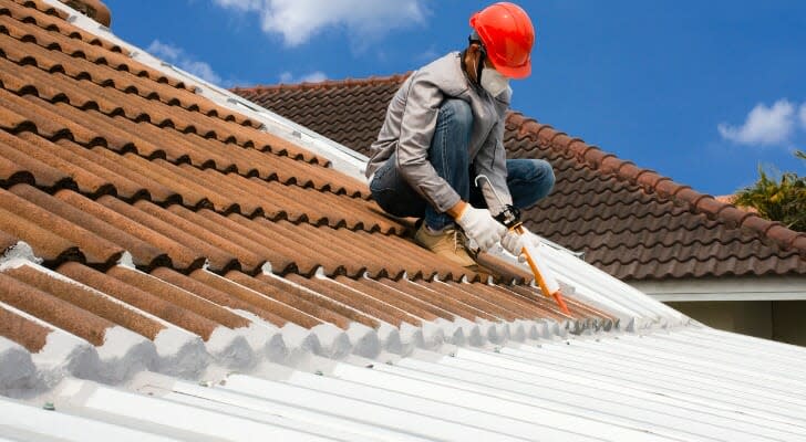 Worker on a rooftop of a new building