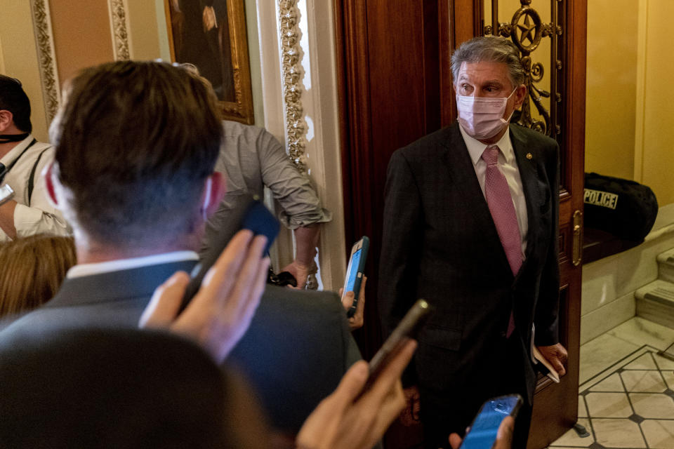 Sen. Joe Manchin, D-W.Va., speaks to reporters as he leaves a Democratic strategy meeting at the Capitol in Washington, Tuesday, Oct. 19, 2021. (AP Photo/Andrew Harnik)