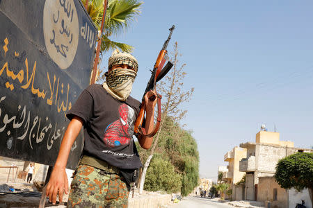 A member of the Turkish-backed Free Syrian Army (FSA) patrols in the border town of Jarablus, Syria, August 31, 2016. REUTERS/Umit Bektas