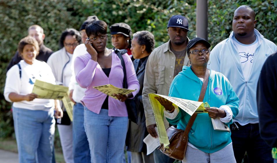 Voters stand in line to vote at an early voting site in Charlotte, N.C., Thursday, Oct. 23, 2008. In three Southern states critical to deciding who will win the White House _ Georgia, Florida and North Carolina _ there are clear signs after several days of early voting that favor Democratic nominee Barack Obama. In North Carolina, for example, 40,000 more blacks who are registered as Democrats have cast an early ballot than have registered Republicans overall. (AP Photo/Chuck Burton)