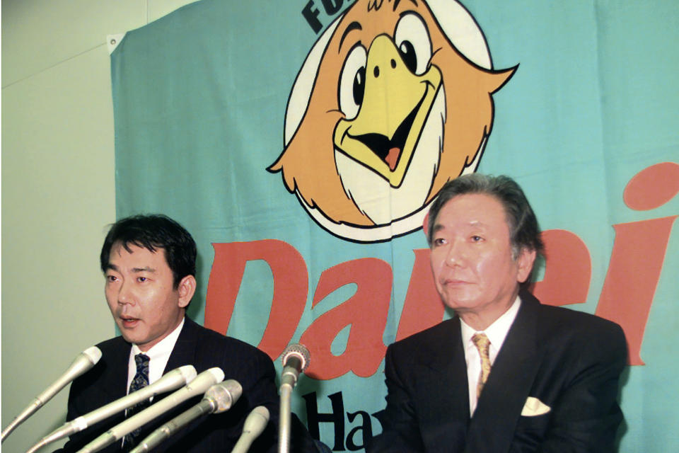 In this December 1998, photo, then Fukuoka Daiei Hawks President Hiroshi Murakami, right, and acting owner Tadashi Nakauchi speak to journalists during a press conference on a suspicion of sign stealing at Fukuoka Dome in Fukuoka, southern Japan. If you thought the use of technology to steal catchers' signs was only a problem for Major League Baseball and the Houston Astros, or something new. Japan went through a similar scandal just over 20 years ago. In a widely reported scandal in 1998, a camera in the Fukuoka Dome was discovered to be focused on the catcher. Officials of the Hawks - now the SoftBank Hawks - reportedly monitored the signs and relayed them by walkie-talkie to fans in the stands, who then used signals to batters to indicated the next pitch. (Kyodo News via AP)