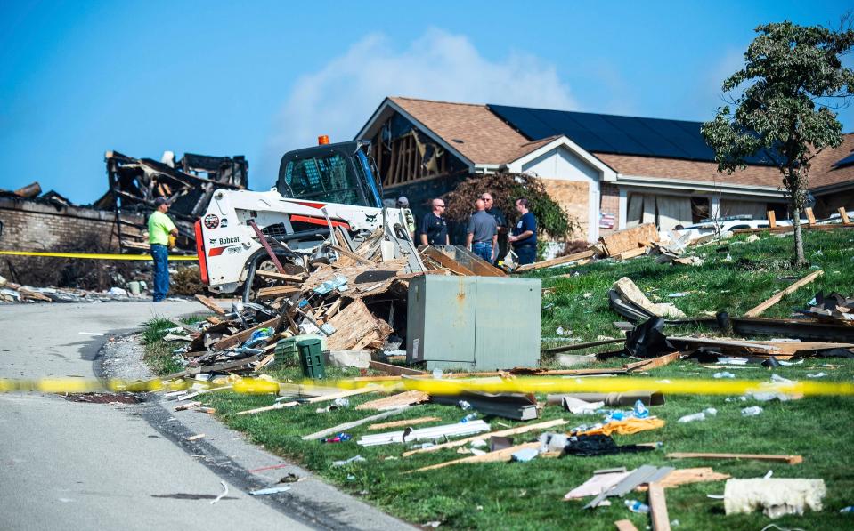 Investigators remain at the scene of a home explosion which occurred the day before on Rustic Ridge Drive in Plum, Pa., Sunday, Aug. 13, 2023.