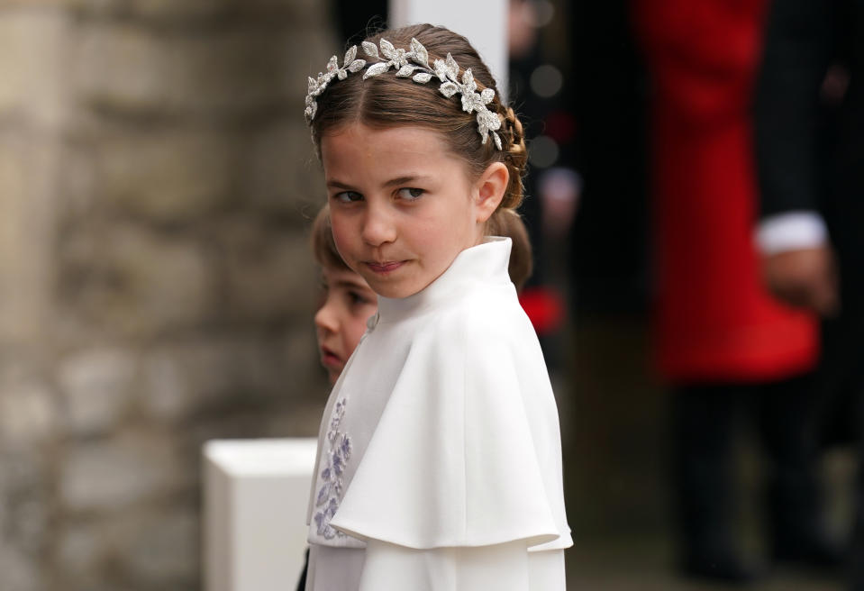 Princess Charlotte entered Westminster Abbey wearing a floral headpiece similar to her mother's. (Photo: Andrew Milligan - WPA Pool/Getty Images)