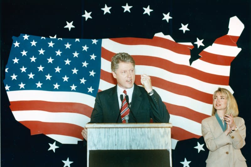 Hillary Rodham Clinton applauds for her husband, Bill Clinton, as he gives a speech on the presidential campaign trail on June 2, 1992, in Los Angeles. Clinton clinched the Democratic presidential nomination on this day in 1992. UPI File Photo