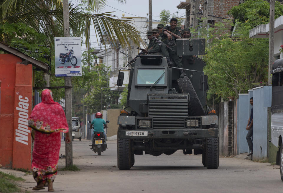 Soldiers return to their base following an operation searching for explosives and suspects tied to a local group of Islamic State militants in Kalmunai, Sri Lanka, Monday, April 29, 2019. The Catholic Church in Sri Lanka on Monday has urged the government to crack down on Islamic extremists with more vigor "as if on war footing" in the aftermath of the Easter bombings. (AP Photo/Gemunu Amarasinghe)