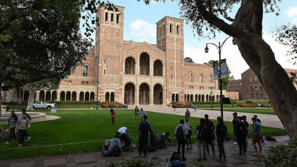 PHOTO: Students gather near Royce Hall on the campus of UCLA, Mar. 11, 2020, in Los Angeles.  (Robyn Beck/AFP via Getty Images)