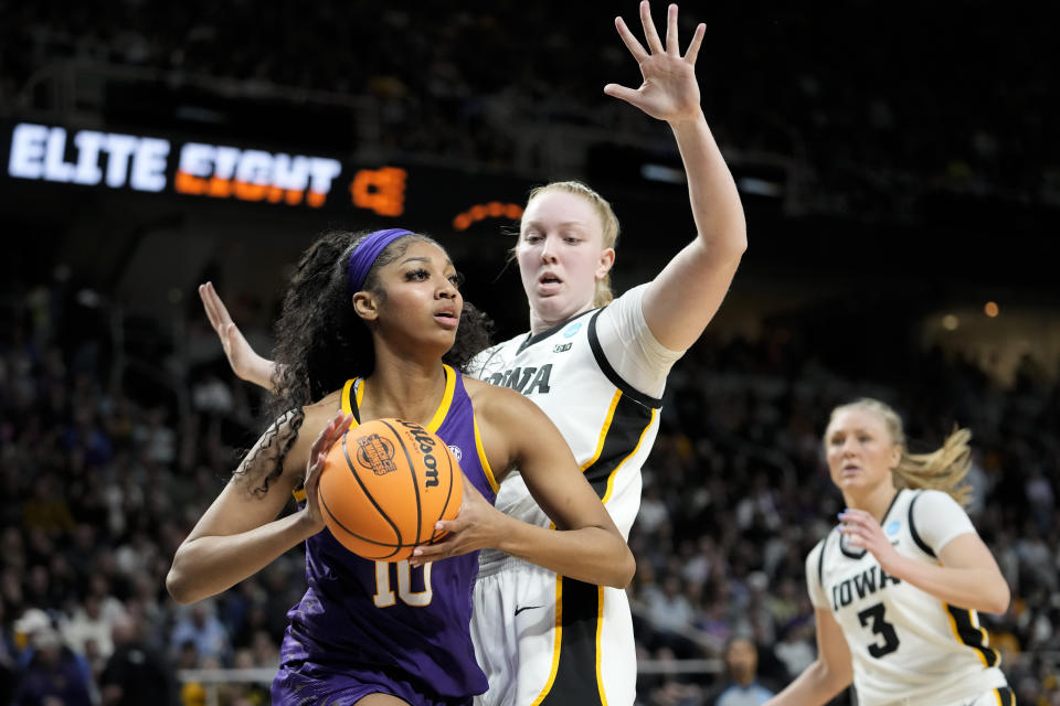 LSU forward Angel Reese (10) looks to pass against Iowa forward Addison O'Grady (44) during the third quarter of an Elite Eight round college basketball game during the NCAA Tournament, Monday, April 1, 2024, in Albany, N.Y. (AP Photo/Mary Altaffer)
