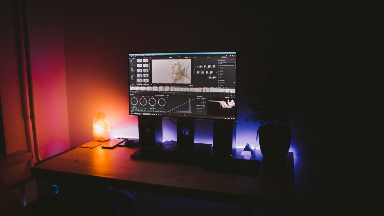  Video editing software on a computer in a dark home studio 