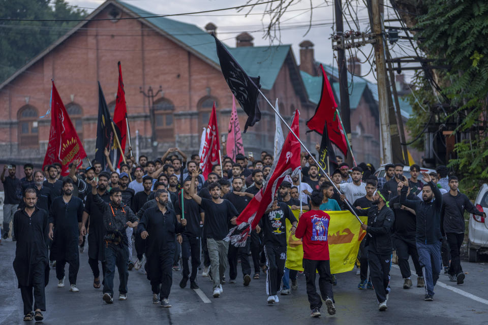 Kashmiri Shiite Muslims participate in a Muharram procession in Srinagar, Indian controlled Kashmir, Thursday, July 27, 2023. Muharram is a month of mourning for Shiite Muslims in remembrance of the martyrdom of Imam Hussein, the grandson of the Prophet Muhammad. (AP Photo/Dar Yasin)