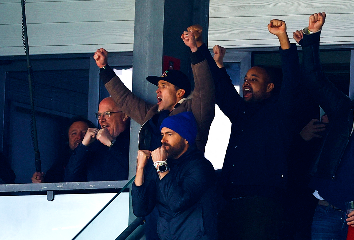 Ryan Reynolds, front, and co-owner Rob McElhenney celebrate Wrexham’s victory (Reuters)