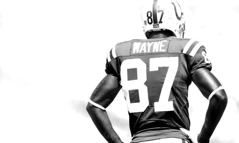 A black and white photo of Reggie Wayne.