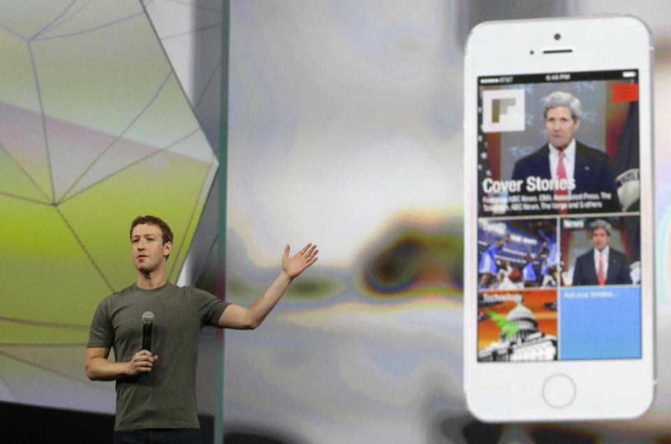 Facebook CEO Mark Zuckerberg gestures while delivering the keynote address at the f8 Facebook Developer Conference Wednesday, April 30, 2014, in San Francisco. (AP Photo/Ben Margot)