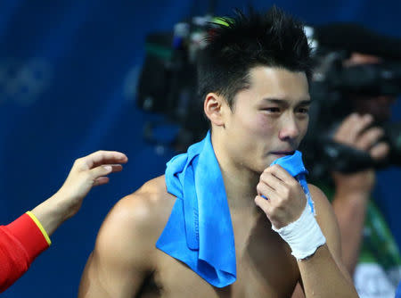 2016 Rio Olympics - Diving - Men's 10m Platform Final - Maria Lenk Aquatics Centre - Rio de Janeiro, Brazil - 20/08/2016. Chen Aisen (CHN) of China reacts after winning the gold. REUTERS/Michael Dalder