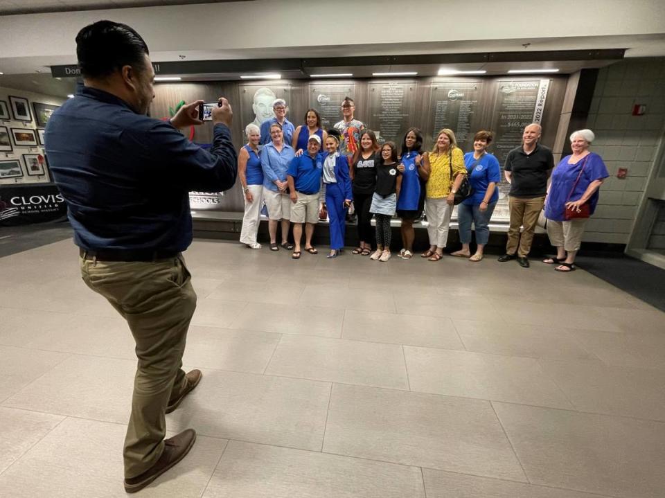 Association of Clovis Educators (ACE) Psychologists and Mental Health Support Providers union and community members supporting them pose for a photo after the Clovis Unified School District board voted unanimously in favor of ratifying the first-ever union-bargained contract in the district on Wednesday evening, June 14, 2023.