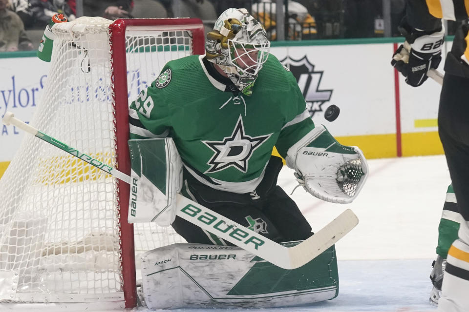 Dallas Stars goaltender Jake Oettinger (29) blocks a shot during the second period of an NHL hockey game against the Pittsburgh Penguins in Dallas, Saturday, Jan. 8, 2022. (AP Photo/LM Otero)