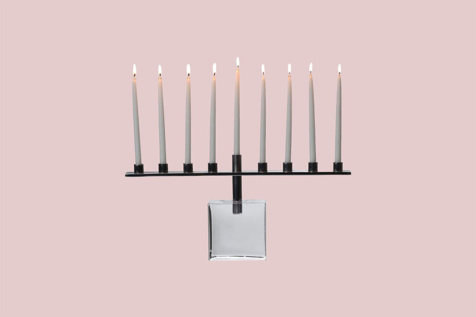 <p>You can always count on a gorgeous glass menorah to brighten your holiday season. This menorah from Simon Pearce, one of our favorite American makers, is handblown by glassblowers using centuries-old techniques and features a polished metal candleholder for added sophistication.</p><p><em>Simon Pearce Woodbury Menorah, $295, </em><a href="https://www.simonpearce.com/woodbury-menorah" rel="nofollow noopener" target="_blank" data-ylk="slk:simonpearce.com;elm:context_link;itc:0;sec:content-canvas" class="link "><em>simonpearce.com</em></a><em>.</em></p>