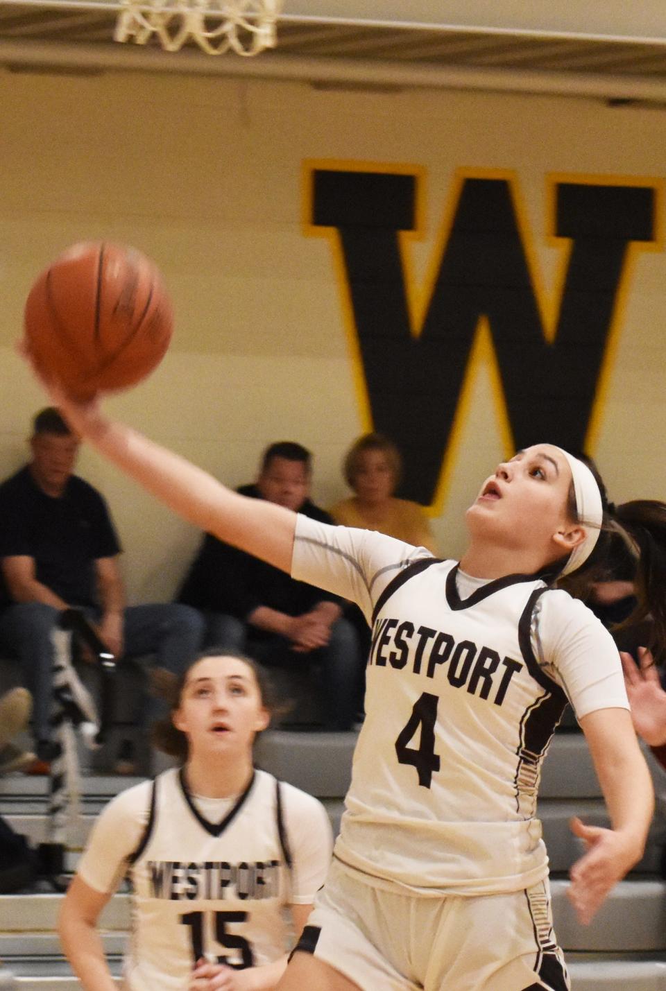 Westport's Leah Sylvain lays up a shot in front of teammate Meghan Molloy in this Feb. 13 file photo.