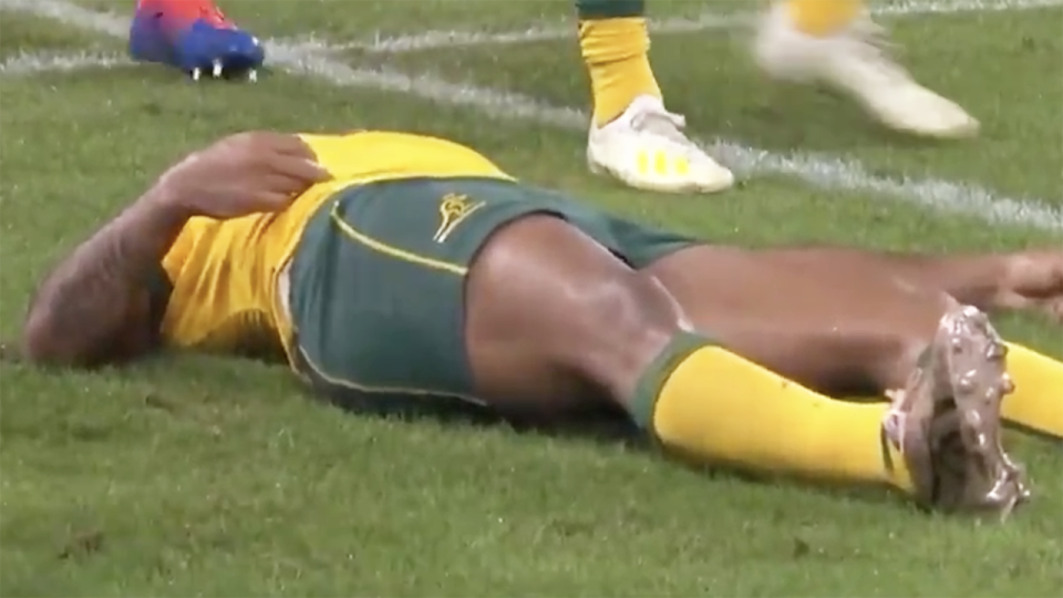 Wallabies star Kurtley Beale lays on the ground after he was knocked out during Australia's final pool match of the Rugby World Cup, against Georgia. Picture: Fox Sports