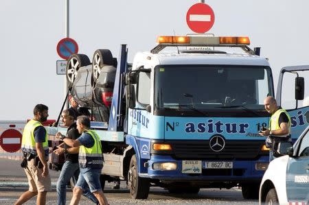 The car on a tow truck is seen where the police investigate the scene of an attack in Cambrils, south of Barcelona, Spain, August 18, 2017. REUTERS/Stringer