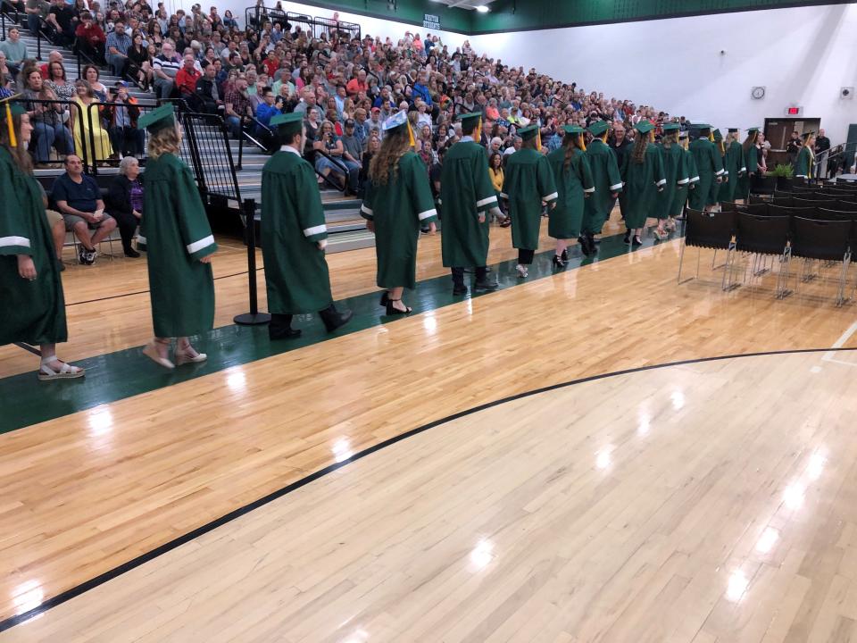 215 seniors file in for commencement on Friday night at Madison Comprehensive High School.