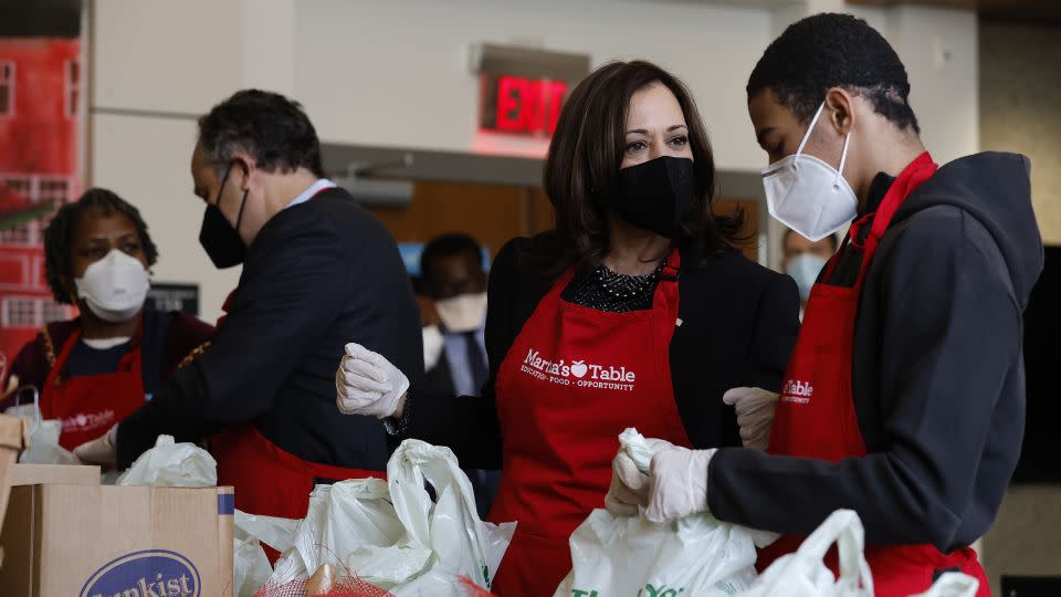 Vice President Kamala Harris (2nd L) talks with volunteers as they fill bags with food at Martha's Table, a community based education, health and family services organization, during Martin Luther King Jr. Day on January 17, 2022 in Washington, DC.  - Chip Somodevilla/Getty Images