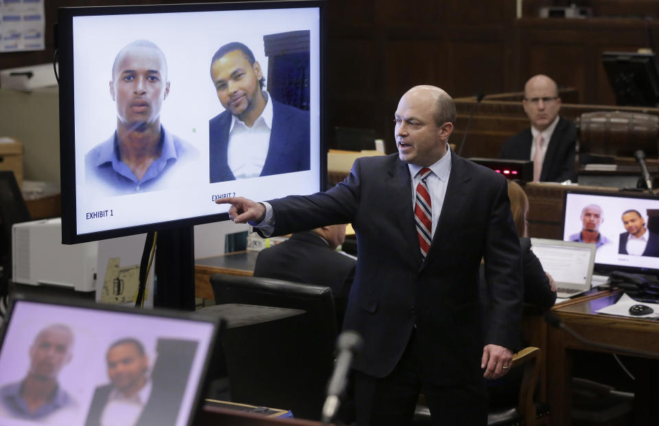 Assistant district attorney Patrick Haggan, center, makes closing arguments in the double murder trial for former New England Patriots tight end Aaron Hernandez as images of murder victims Safiro Furtado, top left, and Daniel de Abreu, top right, are projected on a screen at Suffolk Superior Court, Thursday, April 6, 2017, in Boston. Hernandez is on trial for the July 2012 killings of Daniel de Abreu and Safiro Furtado who he encountered in a Boston nightclub. The former NFL player is already serving a life sentence in the 2013 killing of semi-professional football player Odin Lloyd. (AP Photo/Steven Senne, Pool)