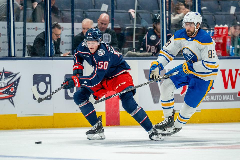 Oct 4, 2023; Columbus, Ohio, United States;
Columbus Blue Jackets left wing Eric Robinson (50) races towards the puck against Buffalo Sabres right wing Alex Tuch (89) during their game on Wednesday, Oct. 4, 2023 at Nationwide Arena.