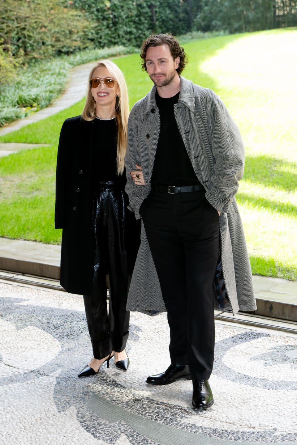 sam taylor johnson and aaron taylor johnson pose at milan fashion week