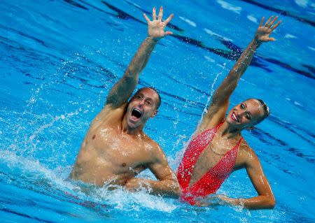 Christina Jones and Bill May of the U.S. perform in the synchronised swimming mixed duet technical final at the Aquatics World Championships in Kazan, Russia, July 26, 2015. REUTERS/Michael Dalder