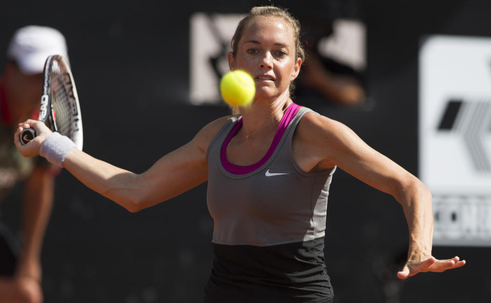 Klara Zakopalova of the Czech Republic returns the ball to Teliana Pereira of Brazil at the Rio Open tennis tournament in Rio de Janeiro, Brazil, Saturday, Feb. 22, 2014. (AP Photo/Leo Correa)