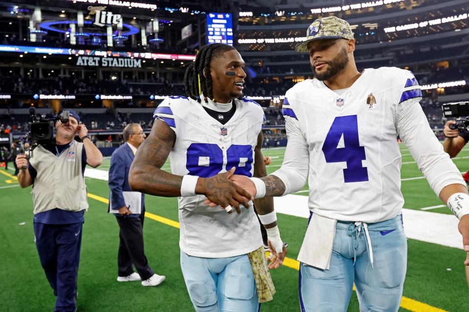 Dallas Cowboys wide receiver CeeDee Lamb (88) celebrates with quarterback Dak Prescott (4) after an NFL football game against the New York Giants, Sunday, Nov. 12, 2023, in Arlington, TX.