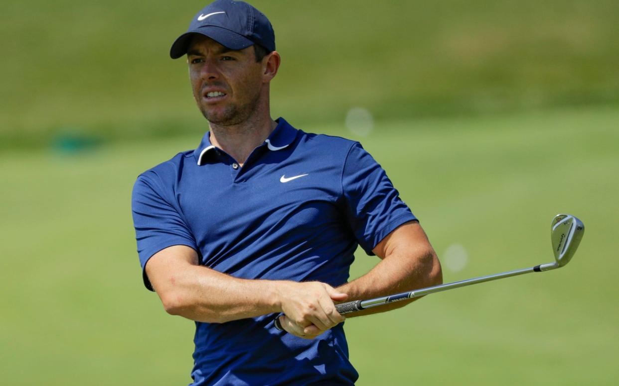 Rory McIlroy hits in the practice area during a practice round for the Memorial golf tournamen - AP