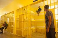 Prisoners spend time in the renovated wing of the Najayo prison in San Cristobal, May 13, 2014. Ten years after the country opened its first prison designed with a focus on education and clean living conditions and staffed by graduates from a newly created academy for penitentiary studies, the New Model of Prison Management is gaining recognition from other countries in the region trying to reduce prison populations and cut recidivism rates. Picture taken May 13, 2014. REUTERS/Ricardo Rojas (DOMINICAN REPUBLIC - Tags: CRIME LAW POLITICS SOCIETY)