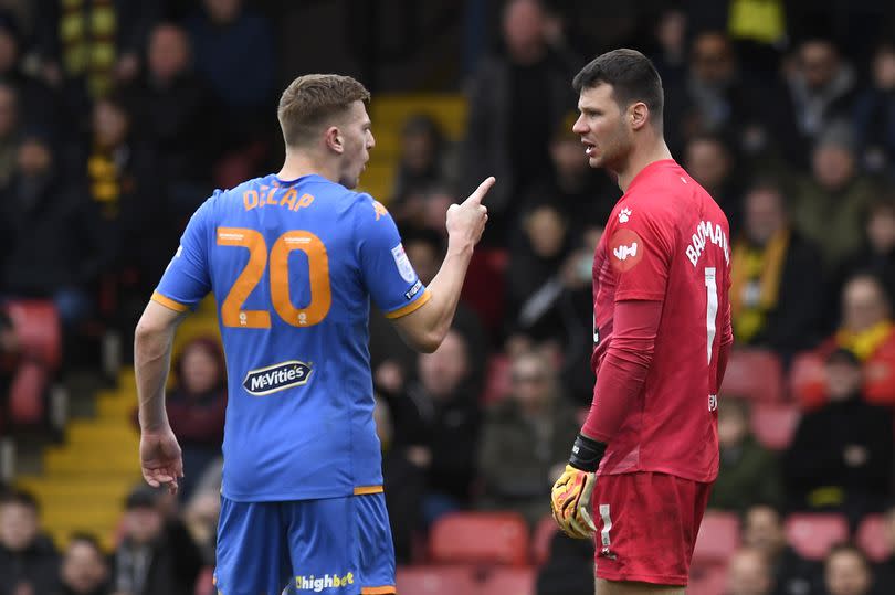 Hull City's Liam Delap in conversation with Watford goalkeeper Daniel Bachmann -Credit:Alan Walter/REX/Shutterstock