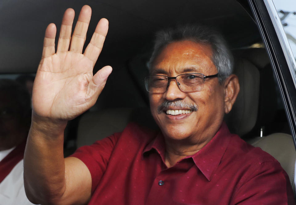 FILE- Sri Lanka's president elect Gotabaya Rajapaksa waves to supporters as he leaves the election commission after the announcement of his victory in Colombo, Sri Lanka, Sunday, Nov. 17, 2019, file photo. The ousted President is expected to return home Friday, Sept. 2, 2022, more than seven weeks after he fled the country amid mass protests that demanded his resignation, holding him and his family responsible for the country's economic crisis. (AP Photo/Eranga Jayawardena, File)