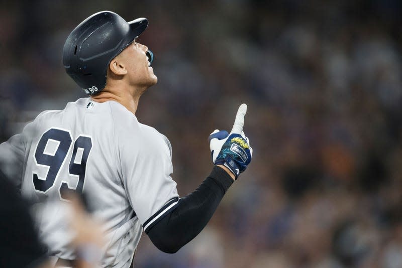 Aaron Judge #99 of the New York Yankees runs the bases as he hits his 61st home run of the season in the seventh inning against the Toronto Blue Jays at Rogers Centre on September 28, 2022, in Toronto, Ontario, Canada. Judge has now tied Roger Maris for the American League record