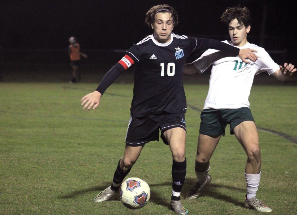 Ponte Vedra's Mark Romano (left) and Fleming Island's Daniel Vizcarrondo challenge for possession during  a high school boys soccer game on December 19, 2022. [Clayton Freeman/Florida Times-Union]