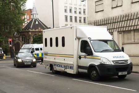 Police vehicles escort a prison van as it arrives at Westminster Magistrates' Court in London, Britain June 18, 2016. Anthony Devlin/Press Association via REUTERS