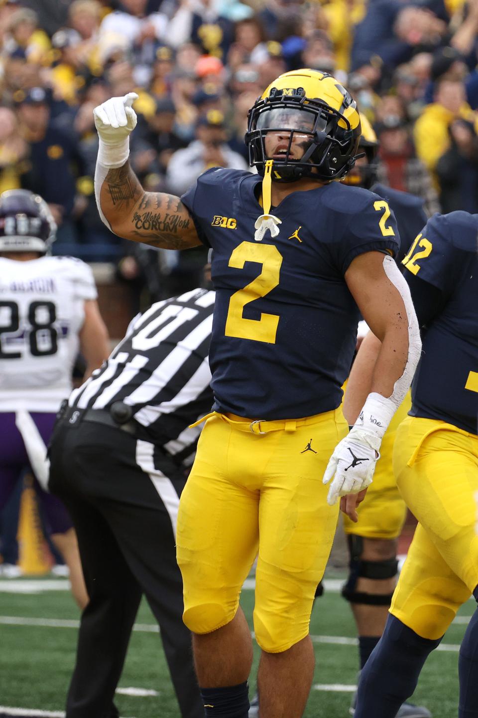 Michigan running back Blake Corum celebrates a touchdown against Northwestern during the first half.