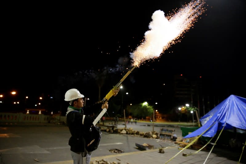 Members of Youth Resistance "Cochala" set off fireworks to celebrate after Bolivian Senator Jeanine Anez became interim president in La Paz