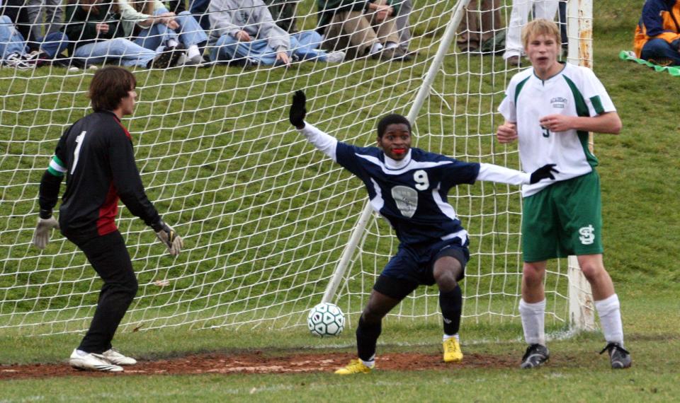 Burlington's Elia Louis (9) reacts to scoring the game's first goal, as St. Johnsbury goalie Sergio Garcia (left) and Adam Strauch stand stunned in the first half of the Seahorses' 2-0 win over the Hilltoppers in the Division I semifinals in 2008.