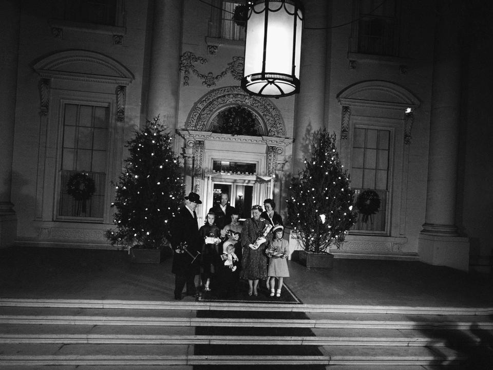 The Eisenhowers pose together on Christmas at the White House in 1958.