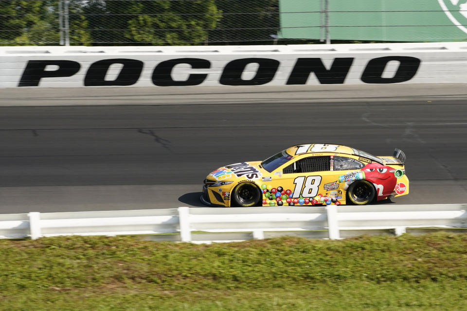 Kyle Busch (18) motors around the track during a NASCAR Cup Series auto race at Pocono Raceway, Sunday, June 27, 2021, in Long Pond, Pa. Busch won the race. (AP Photo/Matt Slocum)