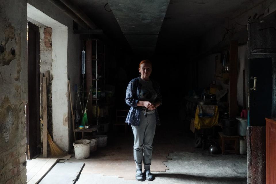 Iryna Babkina, 46, photographed in a corridor of a school shelter in Velyka Novosilka, Donetsk Oblast, on Sept. 11, 2023. (Anastasia Vlasova / The Kyiv Independent)