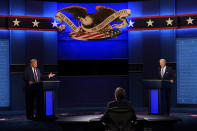 Moderator Chris Wallace of Fox News listens as President Donald Trump and Democratic candidate former Vice President Joe Biden participate in the first presidential debate Tuesday, Sept. 29, 2020, at Case Western University and Cleveland Clinic, in Cleveland, Ohio. (AP Photo/Patrick Semansky)