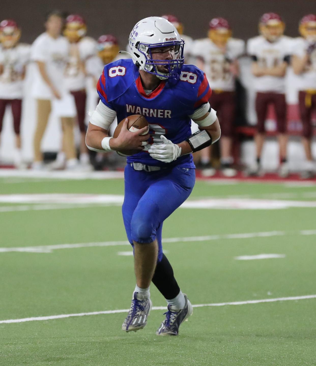 Warner quarterback Hunter Cramer scrambles during the state Class 9A football championship on Thursday, Nov. 9, 2023 in Vermillion's DakotaDome. Warner won 76-54.