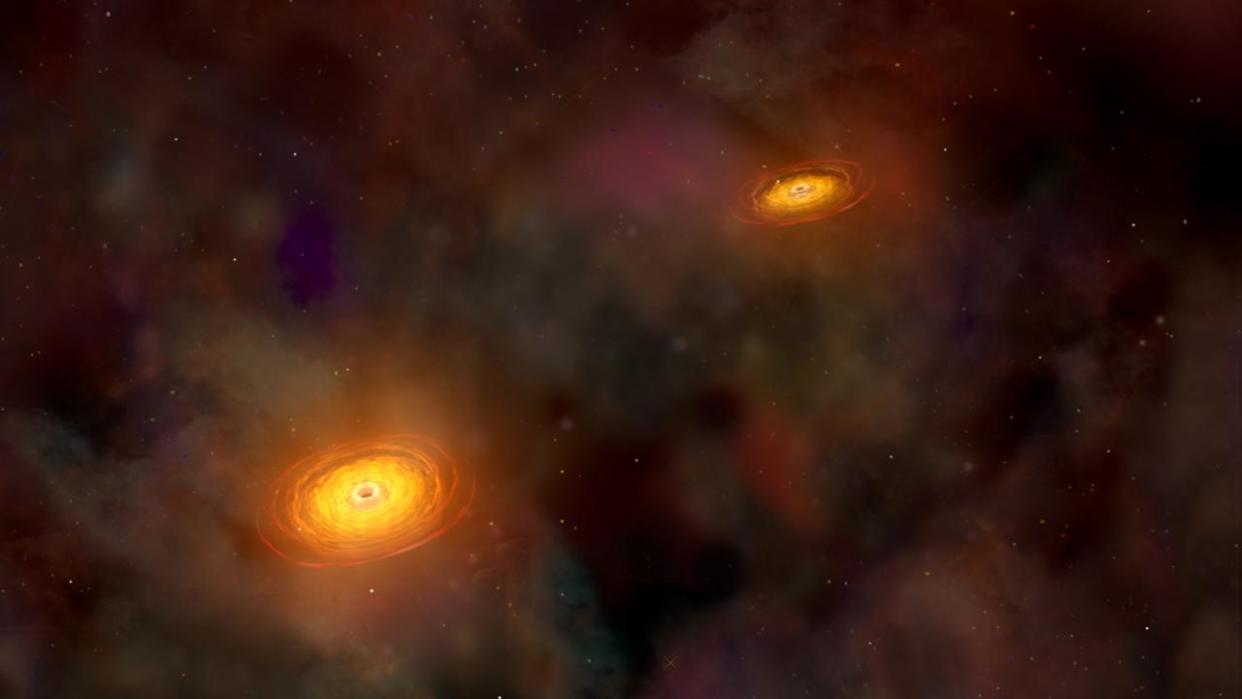 Illustration of supermassive black hole pair: NASA/CXC/A.Hobart