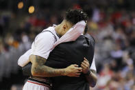 <p>Justin Jenifer #3 and Cane Broome #15 of the Cincinnati Bearcats hug head coach Mick Cronin after being defeated by the Iowa Hawkeyes 79-72 in the first round of the 2019 NCAA Men’s Basketball Tournament at Nationwide Arena on March 22, 2019 in Columbus, Ohio. </p>